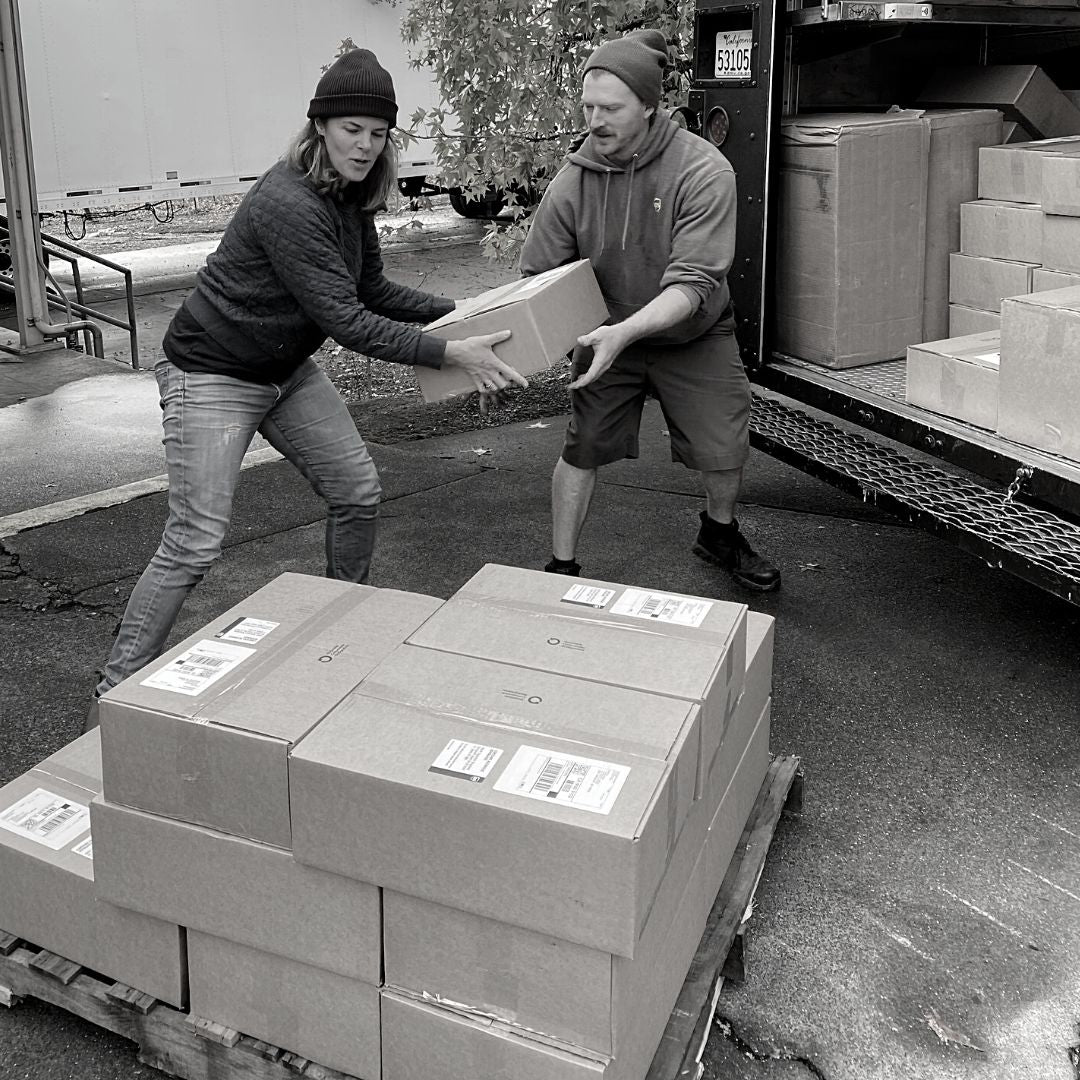 Lynn loading boxes into the UPS truck